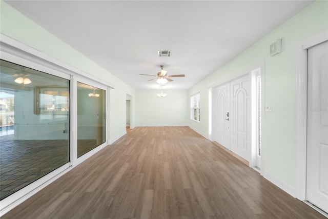 hall with hardwood / wood-style flooring