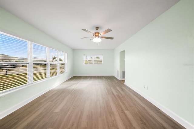 spare room with ceiling fan and light hardwood / wood-style flooring