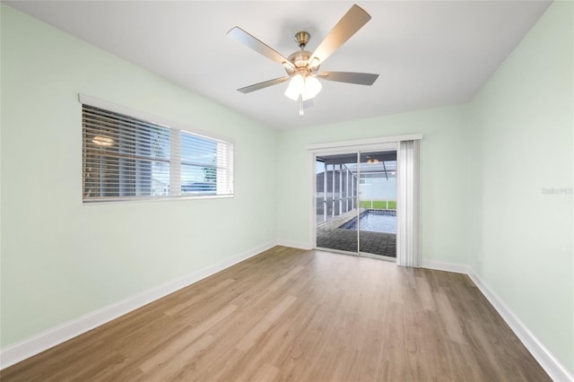 spare room featuring ceiling fan and light wood-type flooring