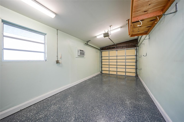 garage with an AC wall unit and a garage door opener