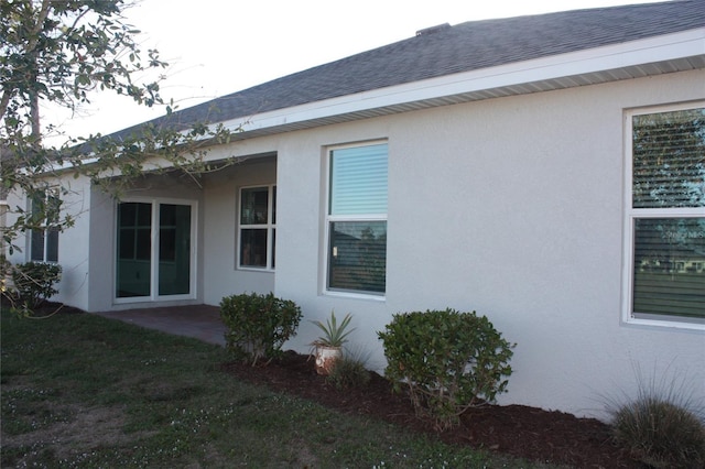 view of side of property with a yard