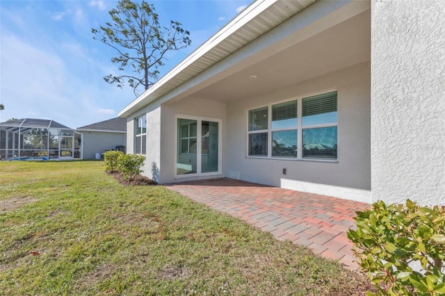 back of house featuring a yard and a patio