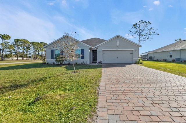 single story home featuring a garage and a front lawn