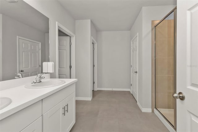 bathroom featuring vanity and a shower with shower door