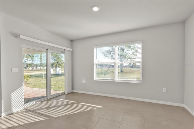 tiled spare room with a wealth of natural light