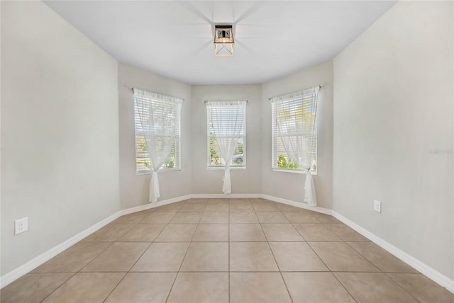 tiled empty room with plenty of natural light