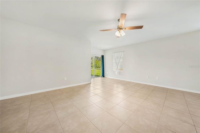 tiled empty room with ceiling fan