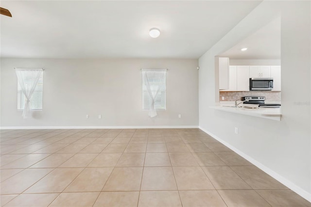 interior space featuring plenty of natural light and light tile patterned flooring