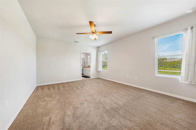 unfurnished room featuring carpet floors and ceiling fan