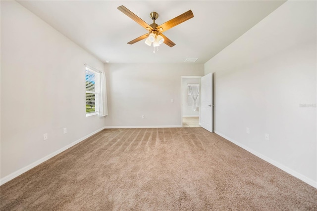 carpeted empty room with ceiling fan