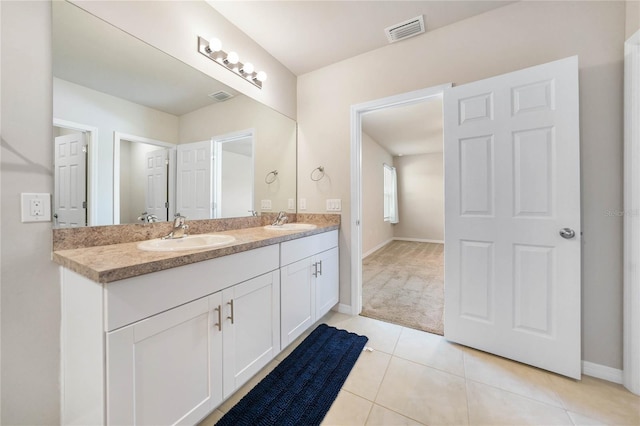 bathroom featuring tile patterned flooring and vanity