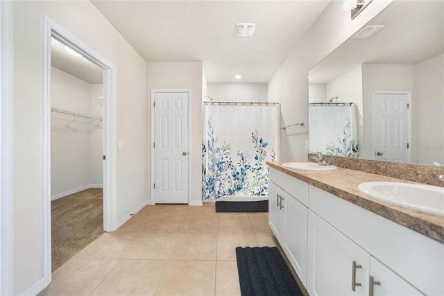 bathroom with vanity, tile patterned floors, and curtained shower