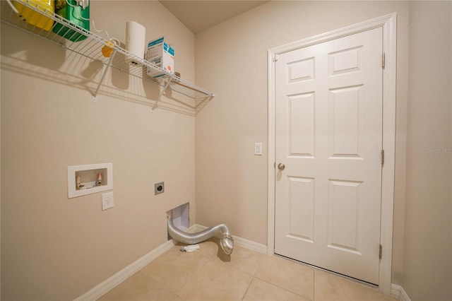 clothes washing area featuring light tile patterned flooring, washer hookup, and hookup for an electric dryer