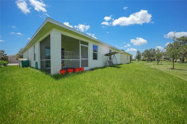 view of home's exterior with a lawn