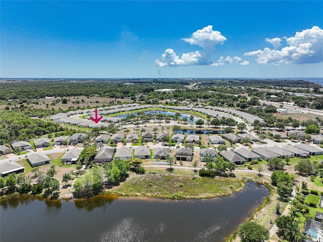 drone / aerial view with a water view