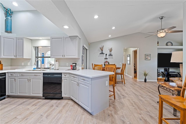 kitchen with kitchen peninsula, ceiling fan, light hardwood / wood-style floors, and black dishwasher