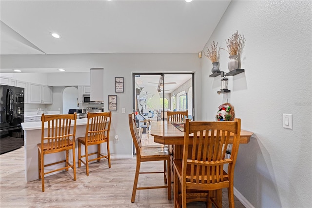 dining area featuring light wood-type flooring