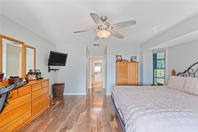 bedroom featuring ceiling fan and wood-type flooring