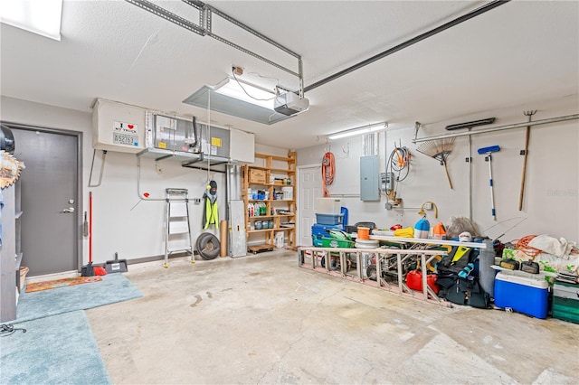 garage featuring electric panel and a garage door opener