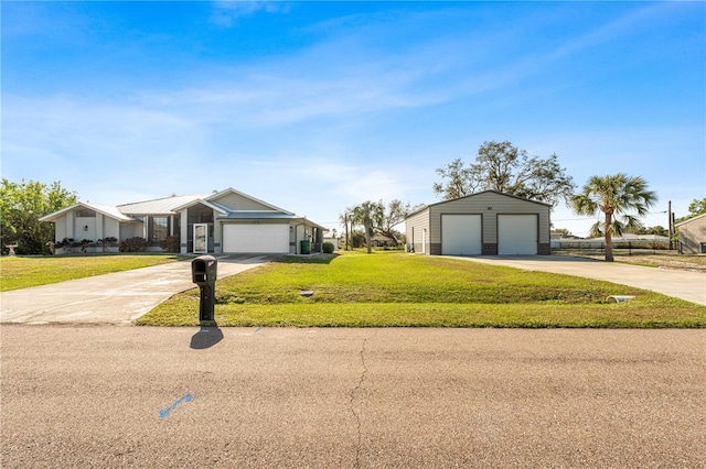 ranch-style home with a garage and a front lawn