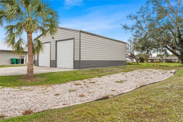 garage featuring a lawn