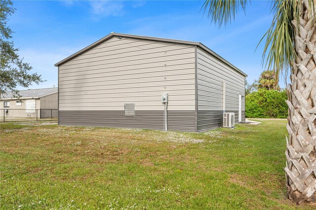 view of side of property with a lawn