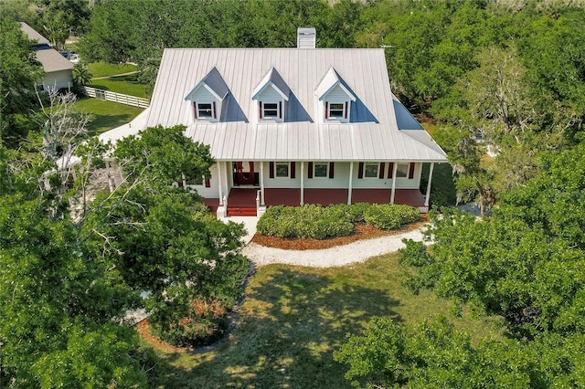 view of front of house featuring a porch and a front yard