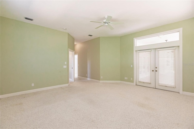 unfurnished room with ceiling fan and french doors