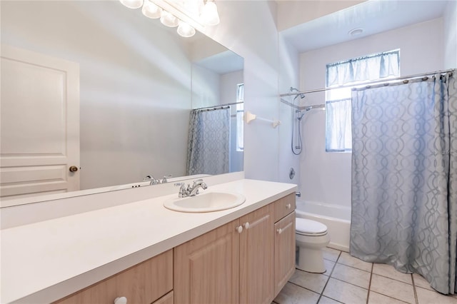 full bathroom featuring tile patterned flooring, vanity, toilet, and shower / bath combo with shower curtain