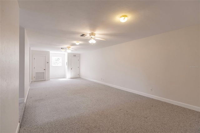 carpeted empty room with ceiling fan