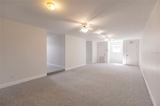 unfurnished room featuring carpet and ceiling fan