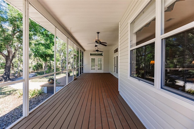 deck featuring ceiling fan and french doors