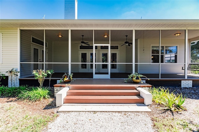 doorway to property with covered porch and ceiling fan