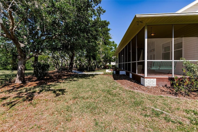 view of yard featuring a sunroom