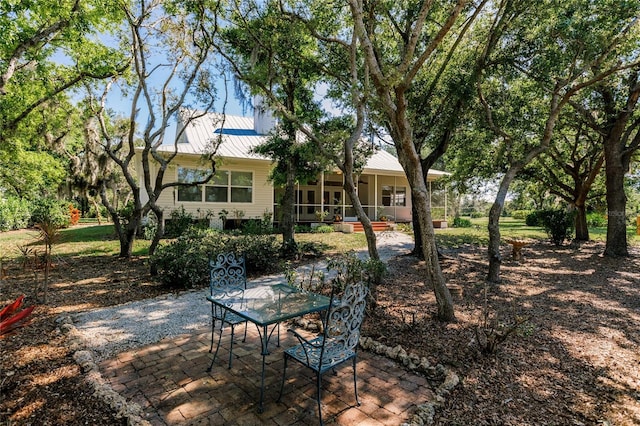 exterior space featuring a porch and a patio area