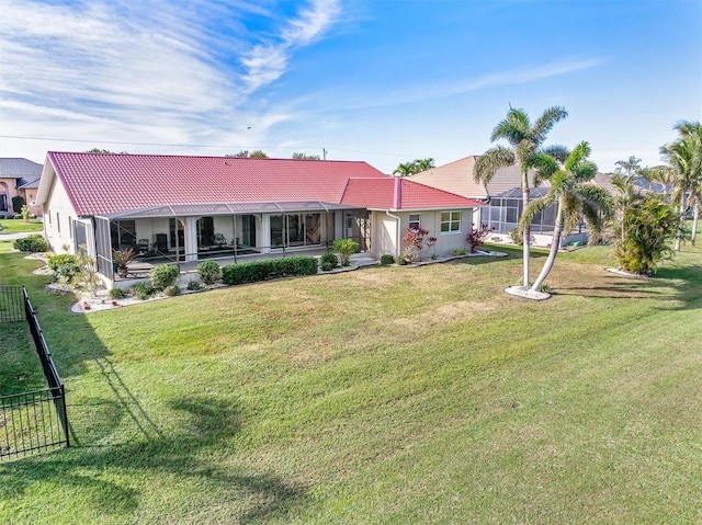 back of house with a yard