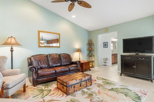 tiled living room with ceiling fan and lofted ceiling