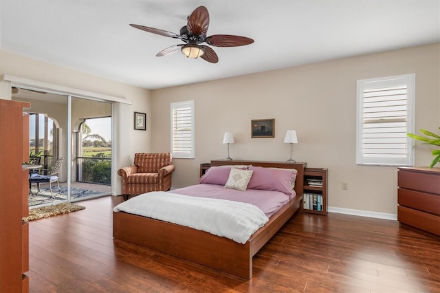 bedroom with ceiling fan, access to exterior, and dark hardwood / wood-style flooring