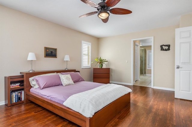 bedroom with dark hardwood / wood-style flooring and ceiling fan