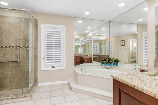 bathroom with vanity, shower with separate bathtub, and tile patterned flooring