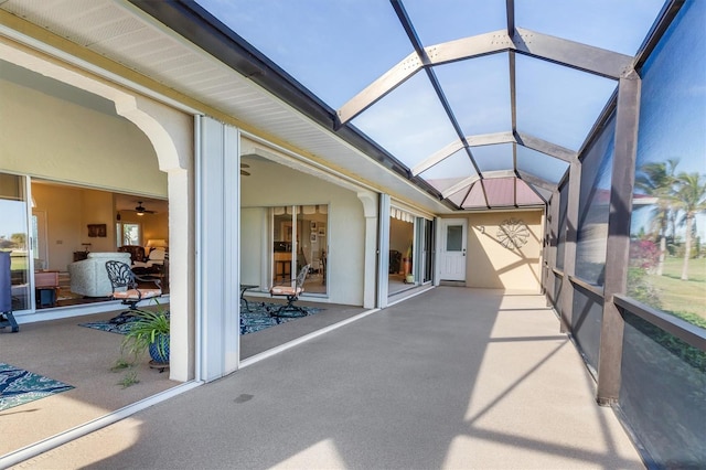 unfurnished sunroom featuring vaulted ceiling