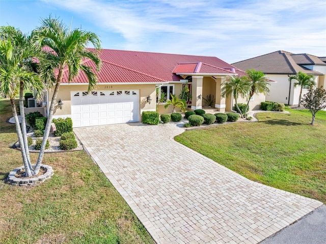 3818 Bordeaux Dr, Punta Gorda, FL 33950 - view of front facade with a garage and a front lawn
