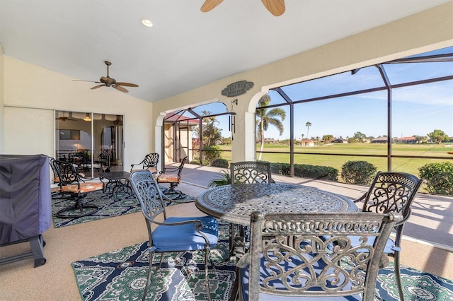 sunroom with vaulted ceiling and ceiling fan