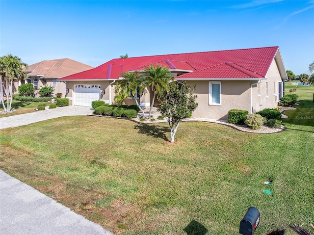 view of front of property featuring a garage and a front yard