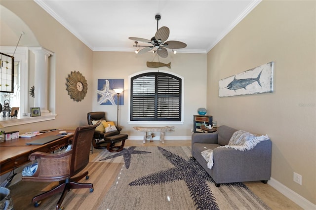 home office with ornate columns, ceiling fan, and ornamental molding