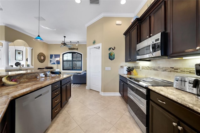 kitchen featuring appliances with stainless steel finishes, ornamental molding, ceiling fan, decorative light fixtures, and light tile patterned flooring