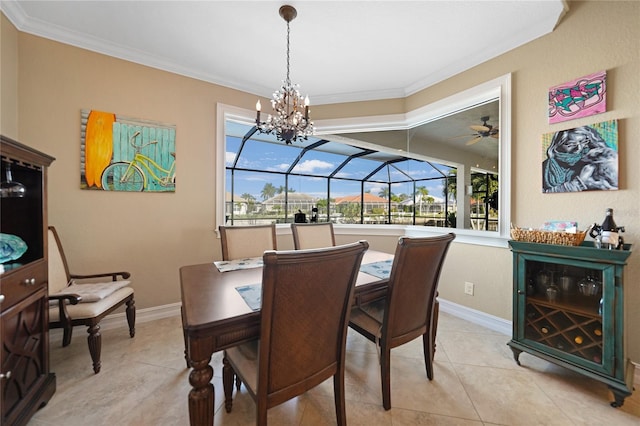 tiled dining area with ceiling fan with notable chandelier and ornamental molding