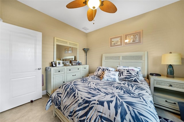 bedroom with ceiling fan and light tile patterned floors