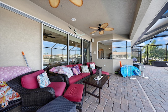 view of patio / terrace featuring an outdoor living space and glass enclosure