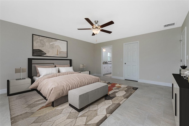 bedroom with ensuite bath and ceiling fan